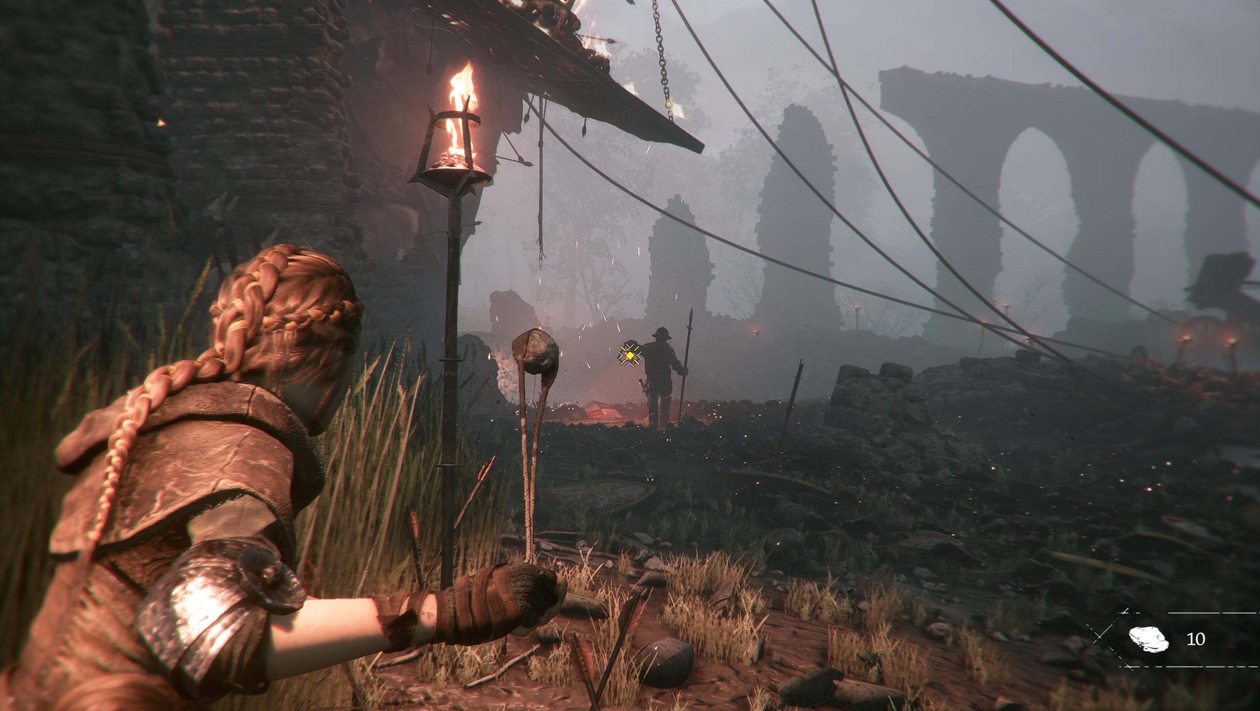Амиция использует пращу, чтобы отвлечь врага в A Plague Tale: Innocence