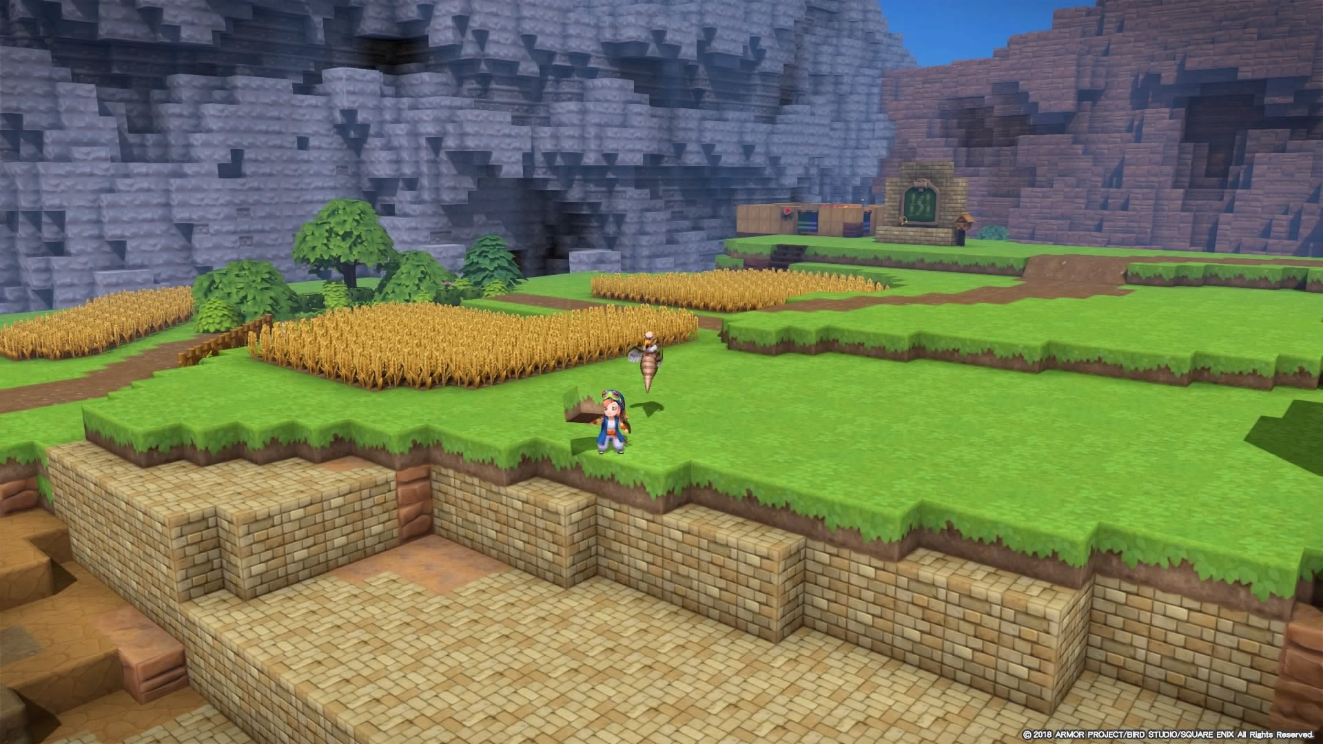 Геймплей Dragon Quest Builders 2 — персонаж возле построек и полей в блочном мире