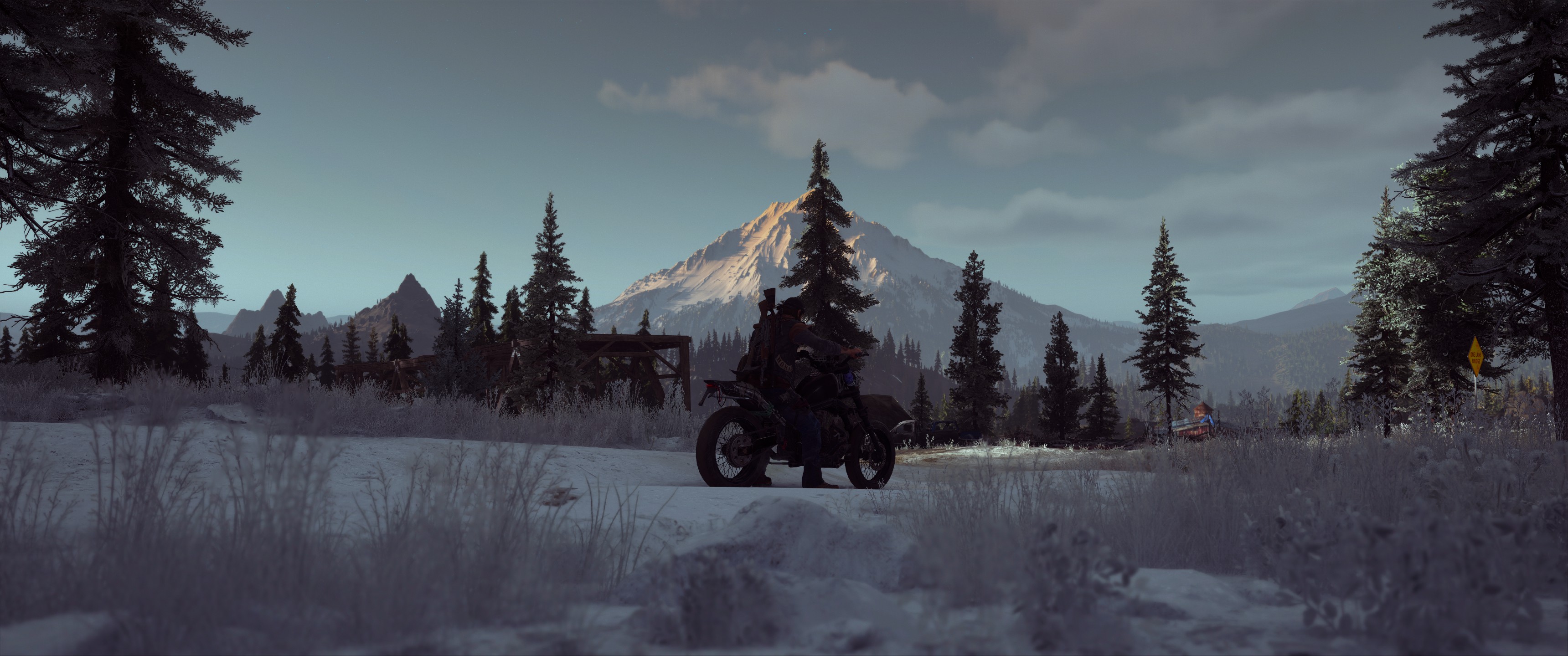 Игровой процесс Days Gone: поездка на мотоцикле по заснеженной дороге